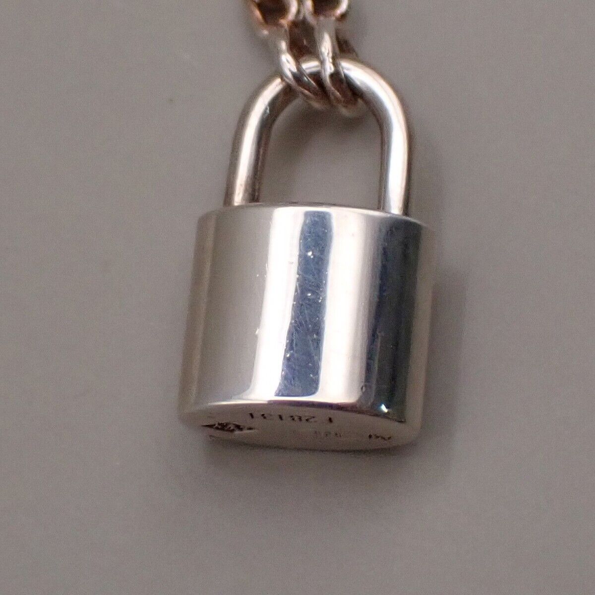 Louis Vuitton Lv Logo Padlock Motif