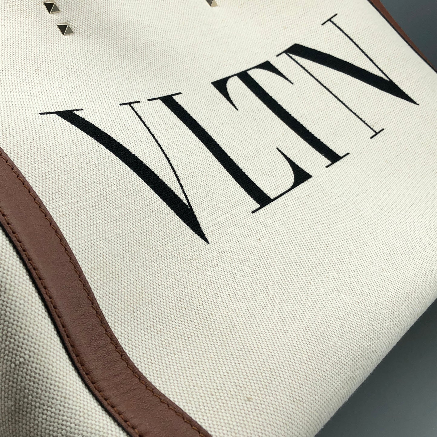Valentino Garavani VLTN Grande Plage tote features canvas Cream/Caramel