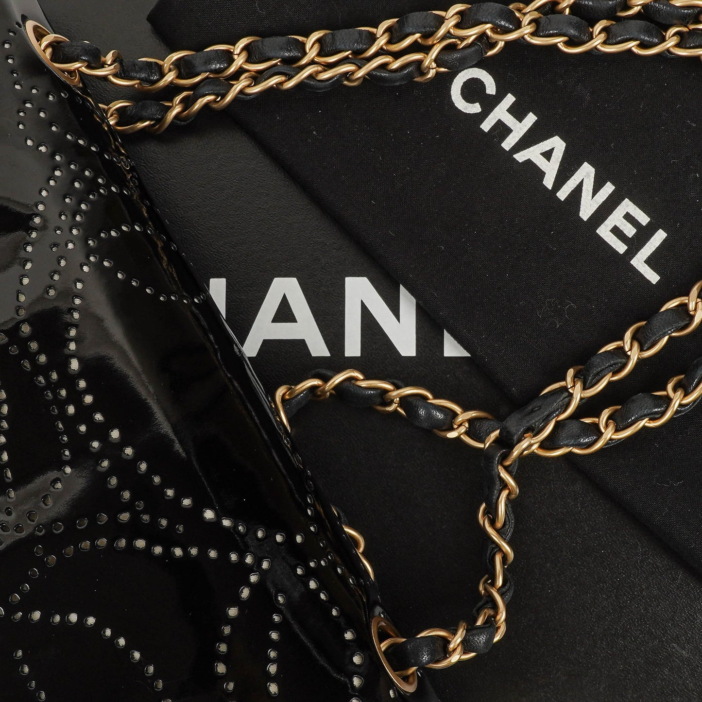 Chanel Camellia Perforated Black Patent Leather Flap Bag