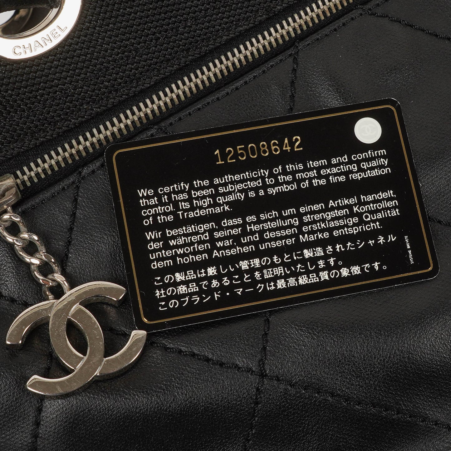Chanel Paris-Biarritz Black Quilted Coated Canvas Grand Shopping Tote Bag