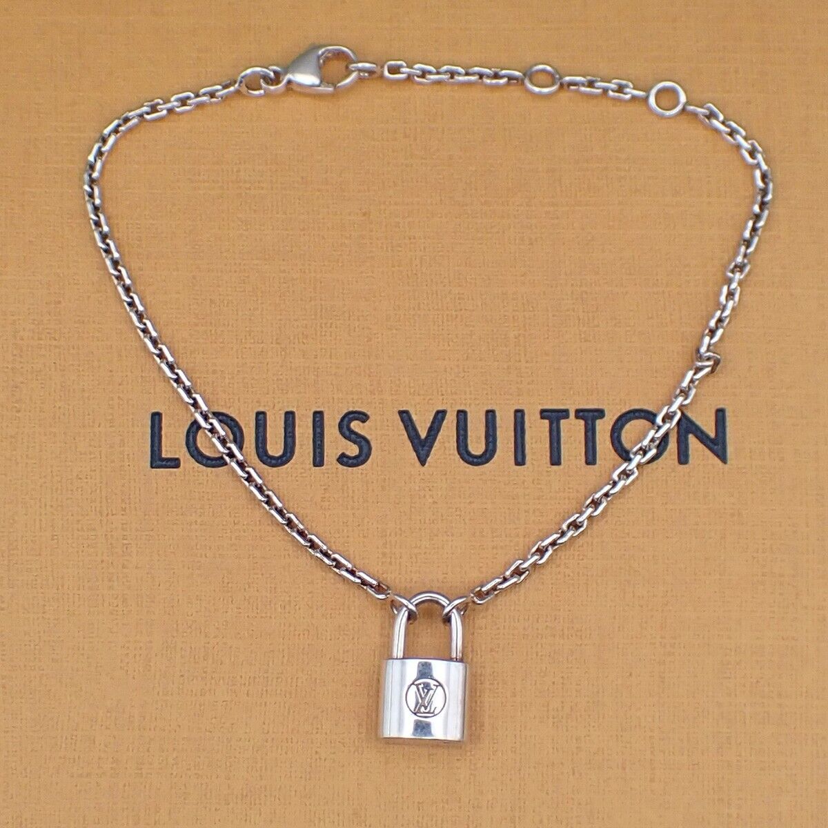 Louis Vuitton Lv Logo Padlock Motif