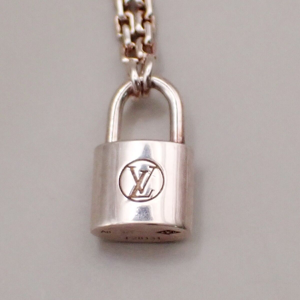 Louis Vuitton Lv Logo Padlock Motif