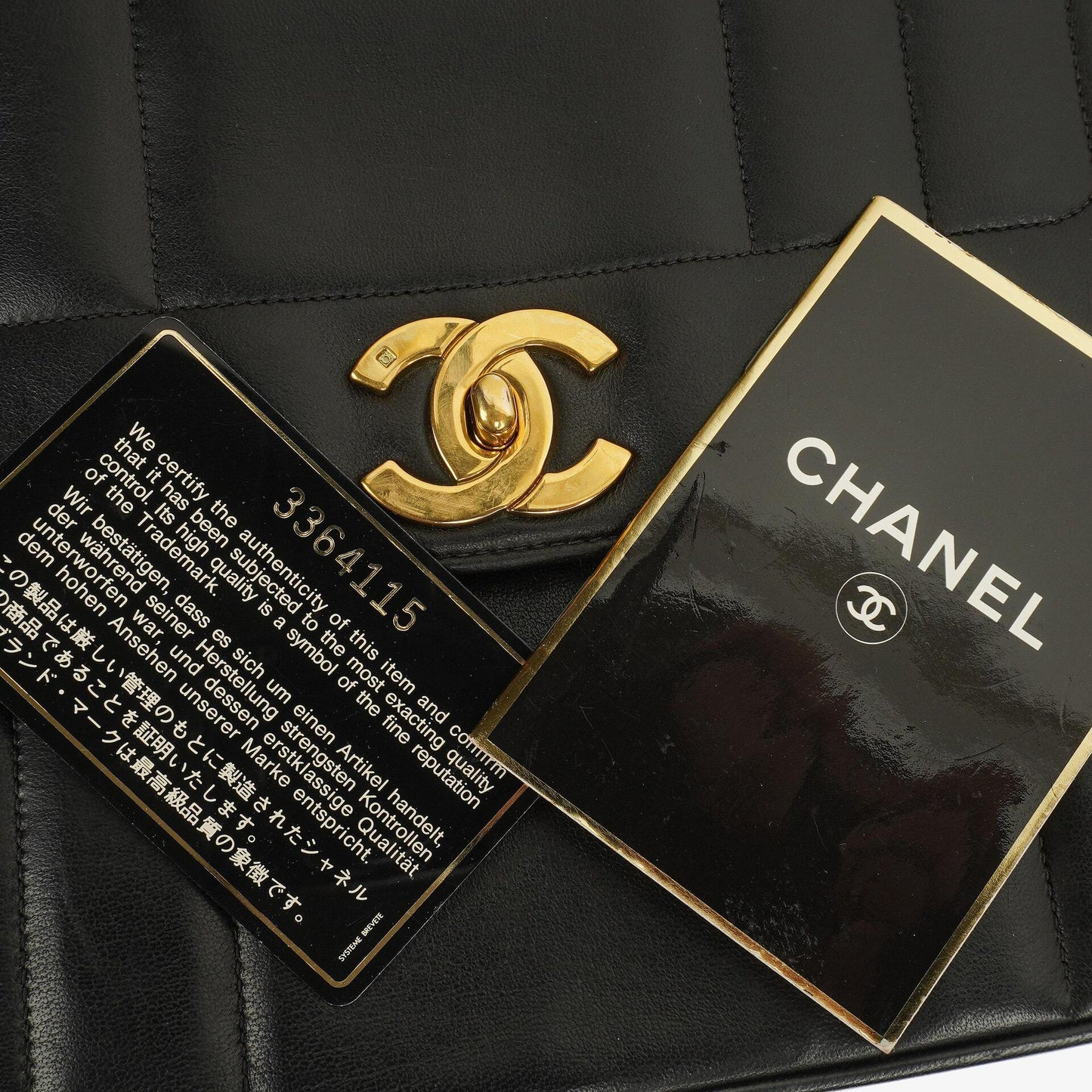 Chanel Kelly Black Vertical Quilted Lambskin Flap Bag With 24K Gold-Plated Hardware