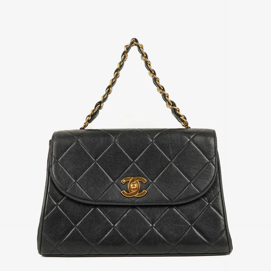 Chanel Flap Bag In Black Quilted Lambskin With Chain Top Handle And 24K Gold-Plated Hardware