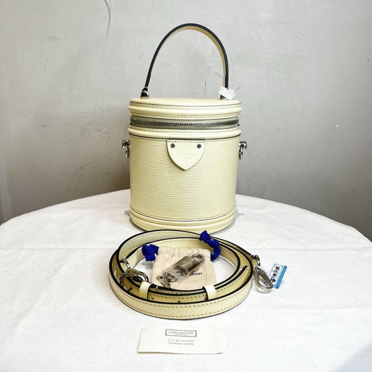 Louis Vuitton LV Epi Bucket Bag with Strap Lock and Key in Ivory Leather